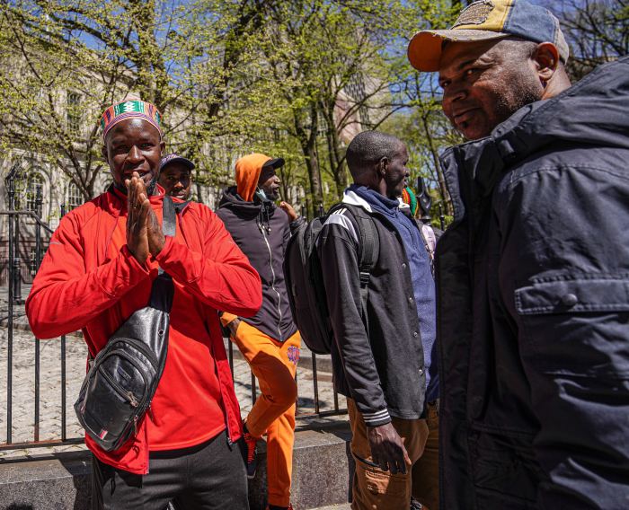 Migrants flood City Hall Park while City Council holds hearing on efforts to aid newcomers from Africa and Latin America 4 several migrants outside City Hall in NYC during the day