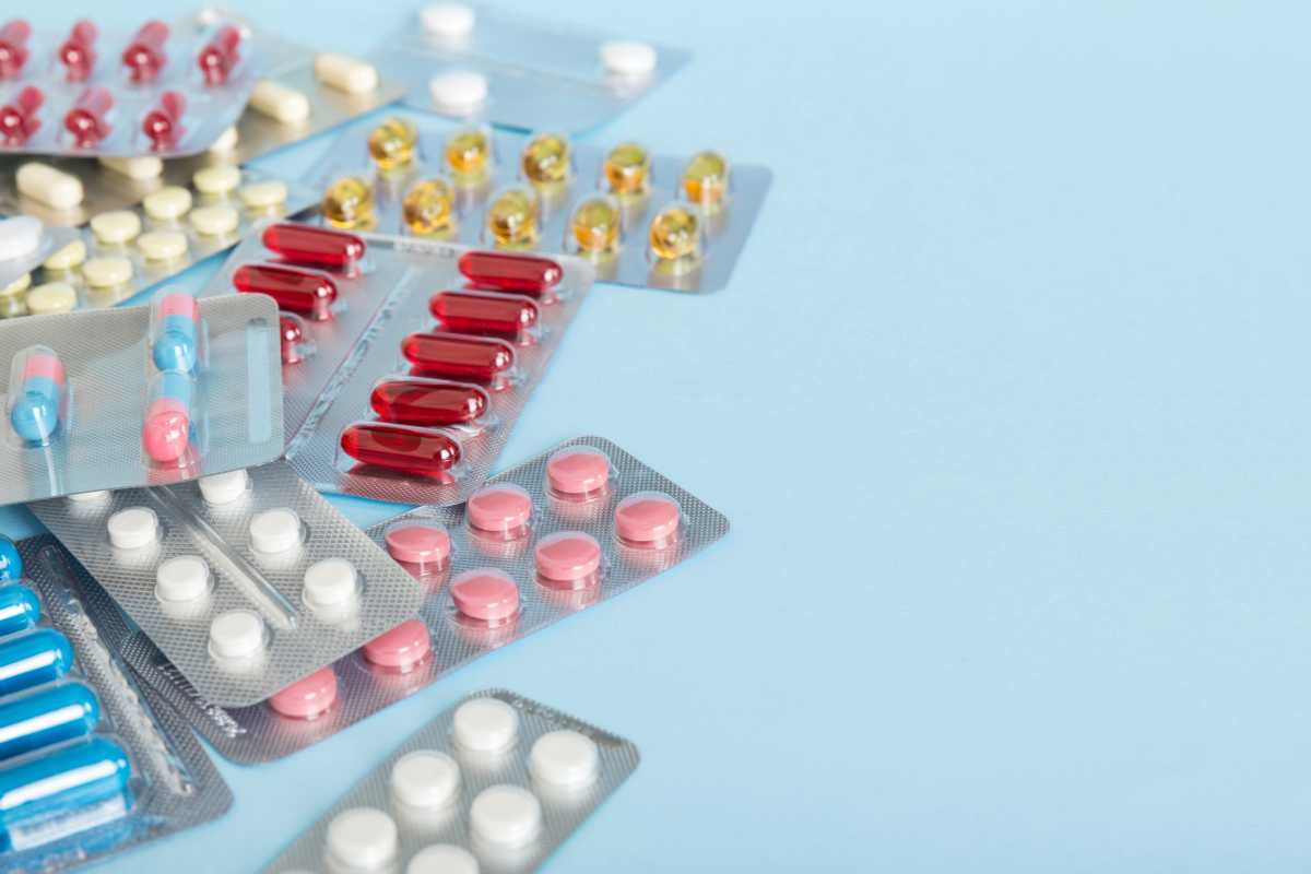 too many different pill of various blisters with different pills Medicines storage at home concept Medication storing. A pile of medicine in blister packs. Pharmaceutical blister packs