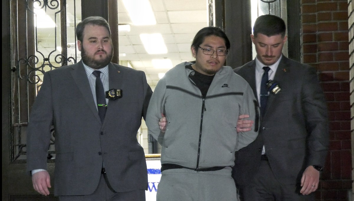 Bronx shooting suspect escorted by detectives