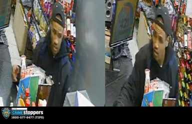 photo of suspect wearing black sweatshirt and black hat who is wanted for robbery in Manhattan