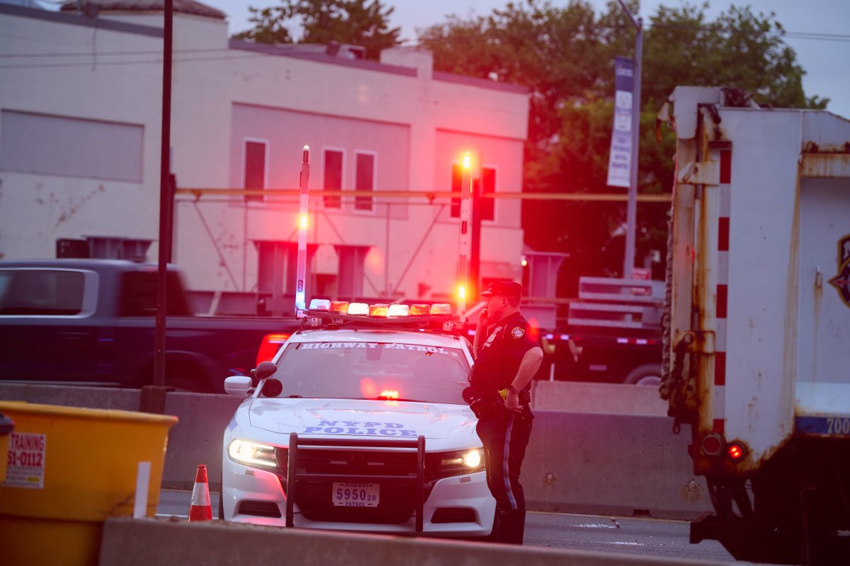 Police vehicle on Van Wyck Expressway where man was struck by NYPD officers' car