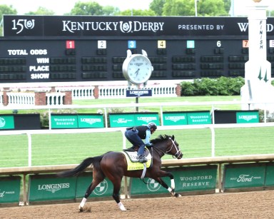 Kentucky Derby hopeful Fierceness races along Churchill Downs dirt track in front of toteboard