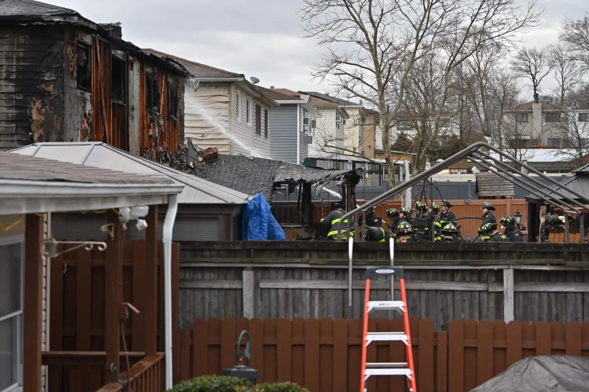 firefighters putting out a house fire on Staten Island