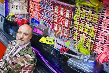 East Village filmmaker Ethan Minsker in front of window display