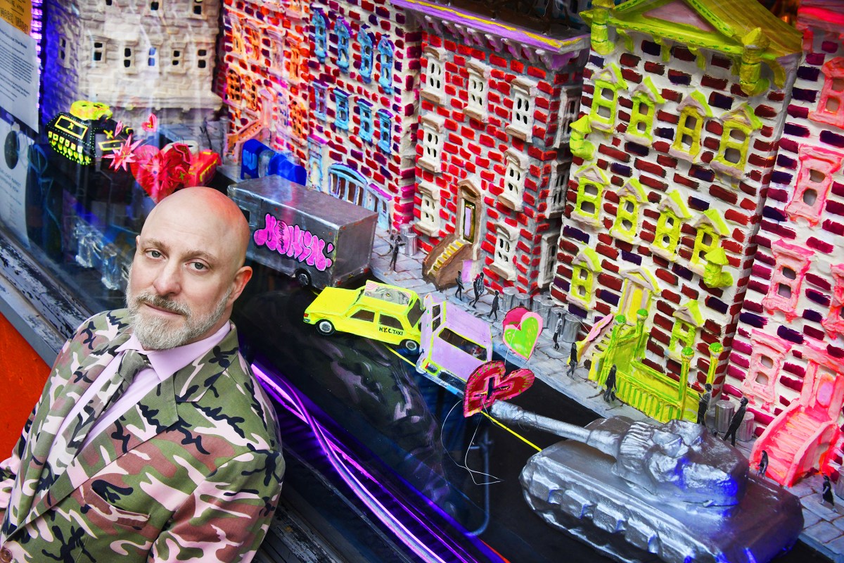 East Village filmmaker Ethan Minsker in front of window display