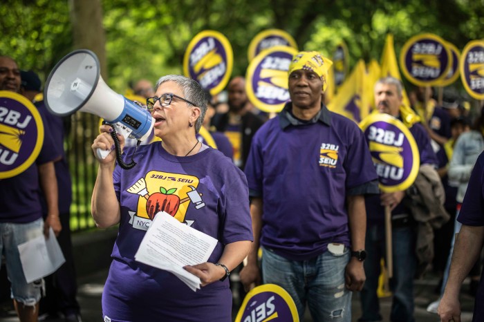 workers gather outside at a rally