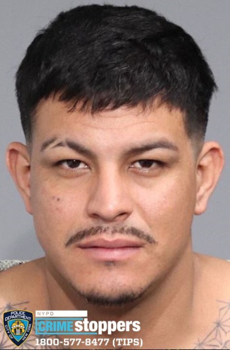 headshot of man with dark hair and mustache