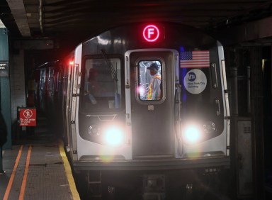 Subway worker on stopped F train