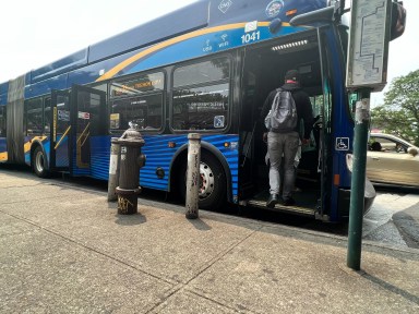 Bus rider boards to pay fare