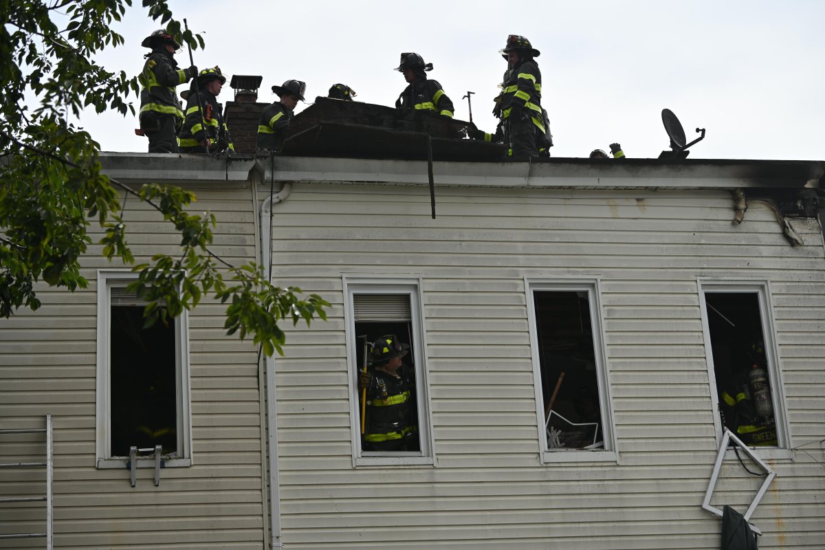 Firefighters take on blaze at Queens home 2 Firefighters operate in the rear during a three alarm fire at 80-16 80 Street.