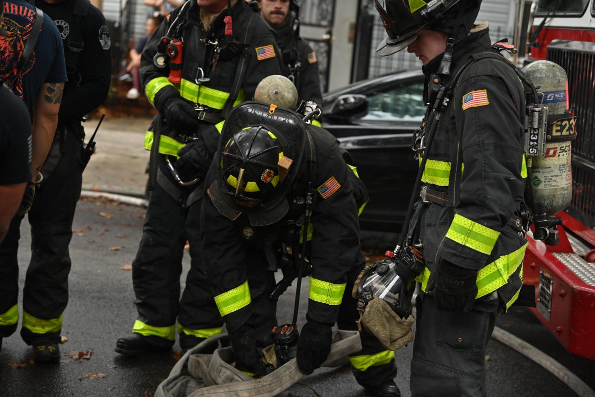 Firefighters take on blaze at Queens home 7 Firefighters operate in the rear during a three alarm fire at 80-16 80 Street.