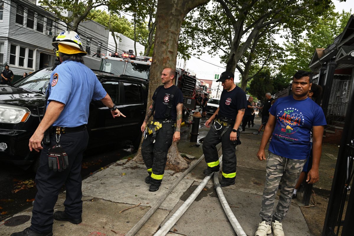 Firefighters take on blaze at Queens home 5 Firefighters operate in the rear during a three alarm fire at 80-16 80 Street.
