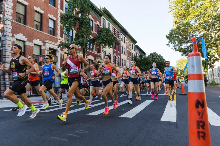 Ready to Run: The Percy Sutton Harlem 5K comes to Harlem Week this Saturday 2 people running in the street in the Percy Sutton 5K Run in Harlem