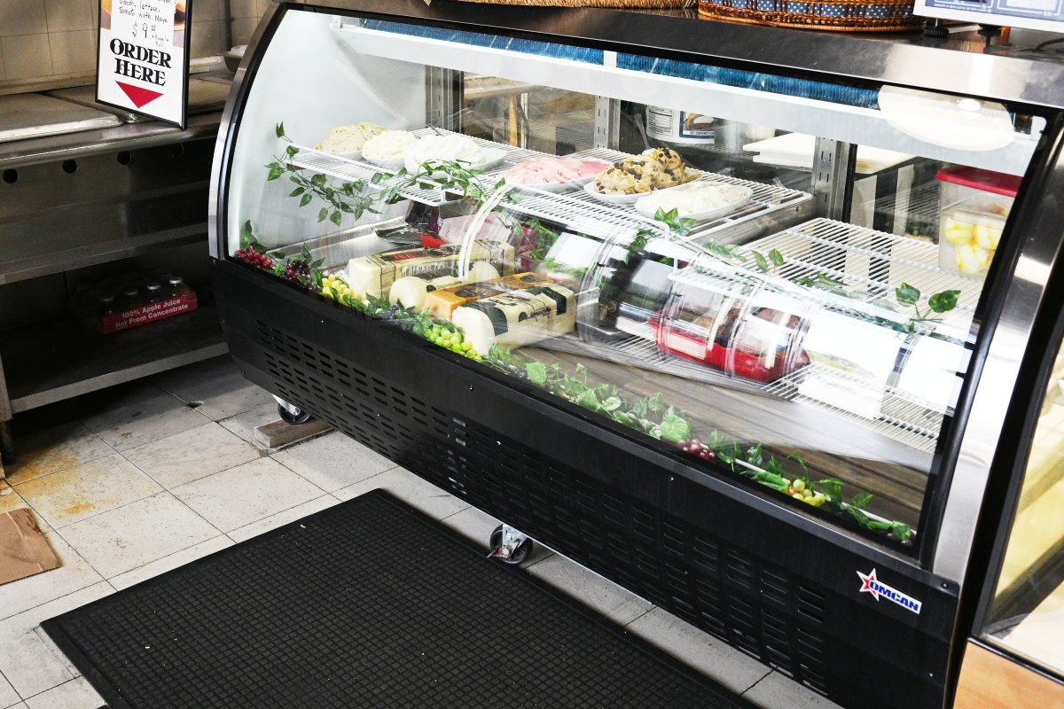 deli counter that has spreads and cheese