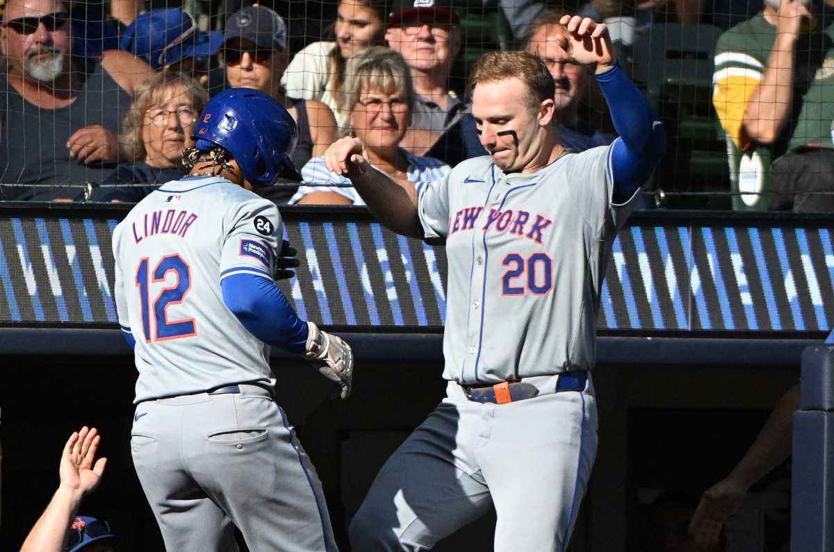 Sep 29, 2024; Milwaukee, Wisconsin, USA;New York Mets shortstop Francisco Lindor (12) celebrates with New York Mets first base Pete Alonso (20) after hitting a home run against the Milwaukee Brewers in the sixth inning at American Family Field.