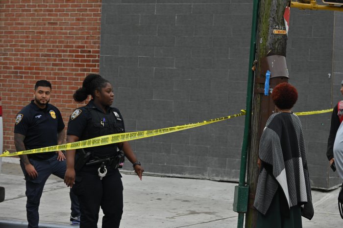 Two teens shot, one arrested near middle school in Canarsie 3 police at an outdoor crime scene