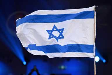 The flag of Israel is seen during a Jewish community vigil marking the first anniversary of Hamas' October 7 attack on Israel in Moorabbin, Melbourne, Australia, October 7, 2024. AAP/James Ross via REUTERS