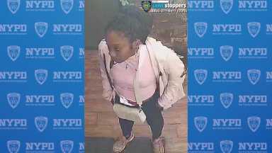 woman wearing white sweater wanted for random attack in Lower Manhattan