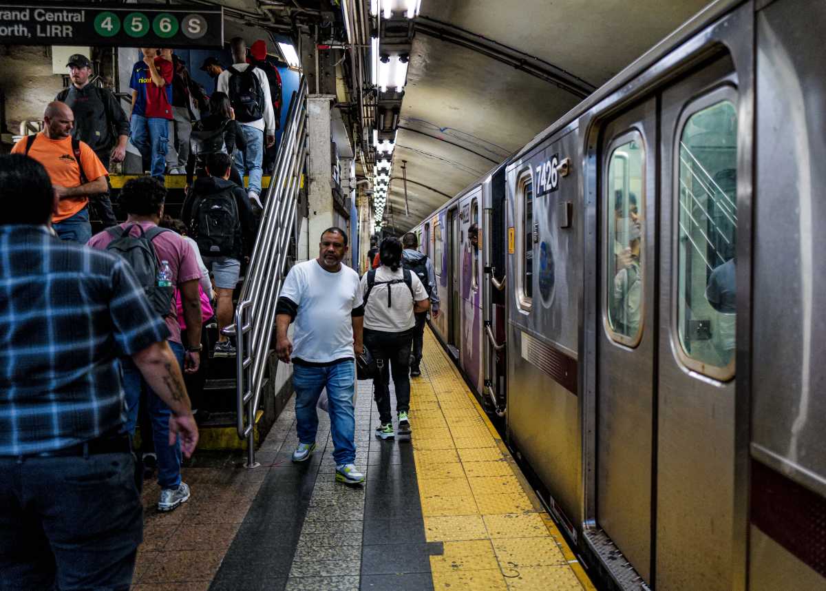 Riders at the Grand Central station on the 7 train in Manhattan on Oct. 22, 2024.