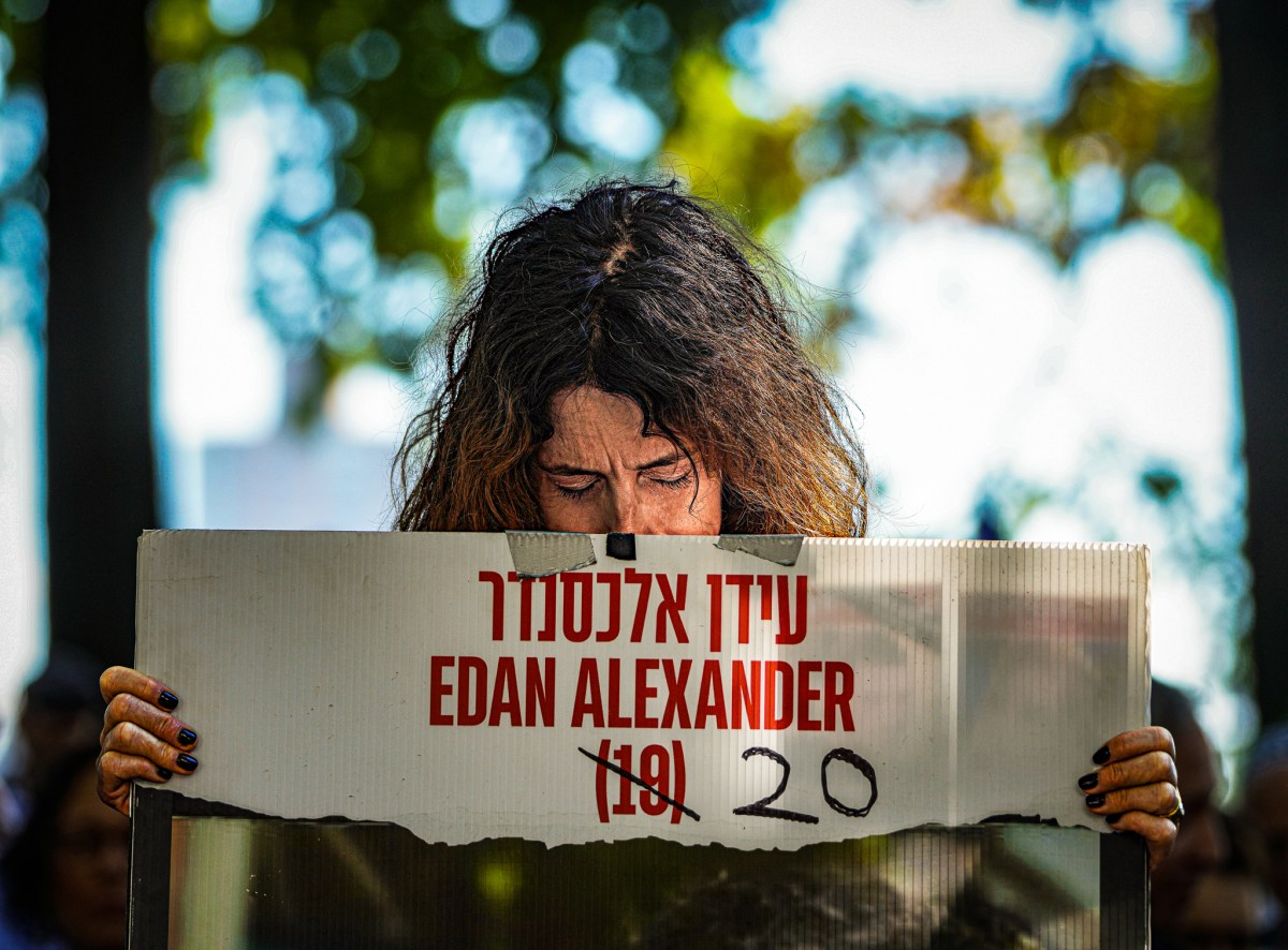 Among the mourners, the families of those who are still held against their will by Hamas spoke out on their plight, clutching the photos of their loved ones, the ages crossed out and their updated ages scrawled in one behind it. 
