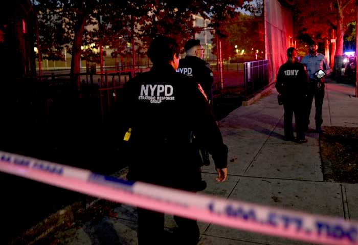 FILE - Police at a shooting scene