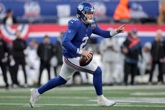 East Rutherford, New Jersey, USA; New York Giants quarterback Drew Lock (2) looks to pass as he runs with the ball against the New Orleans Saints during the fourth quarter at MetLife Stadium.