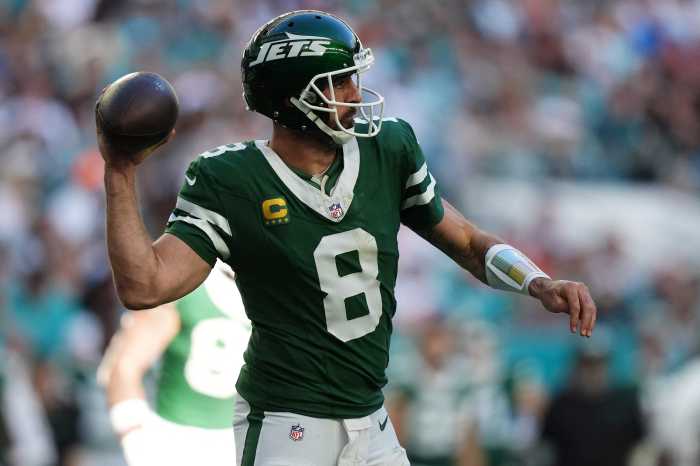 Miami Gardens, Florida, USA; New York Jets quarterback Aaron Rodgers (8) attempts a pass against the Miami Dolphins during the second half at Hard Rock Stadium.