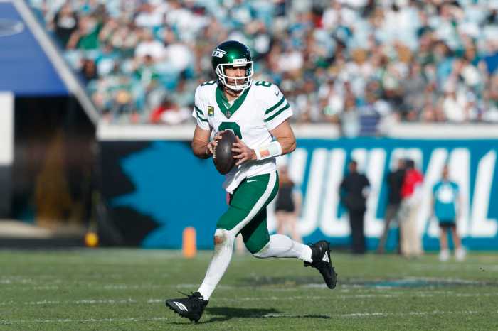 Jacksonville, Florida, USA; New York Jets quarterback Aaron Rodgers (8) looks for a pass against the Jacksonville Jaguars during the fourth quarter at EverBank Stadium.