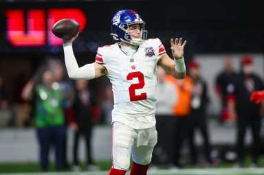 Dec 22, 2024; Atlanta, Georgia, USA; New York Giants quarterback Drew Lock (2) throws a pass against the Atlanta Falcons in the third quarter at Mercedes-Benz Stadium.