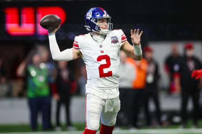 Dec 22, 2024; Atlanta, Georgia, USA; New York Giants quarterback Drew Lock (2) throws a pass against the Atlanta Falcons in the third quarter at Mercedes-Benz Stadium.