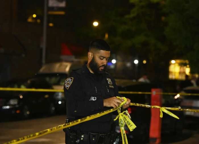 FILE - Police at a Brooklyn crime scene