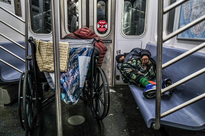 Hochul touts progress in fighting transit crime a year after rolling out subway safety plan 2 Homeless individuals sleeping on a subway train in New York on Jan. 13, 2025.