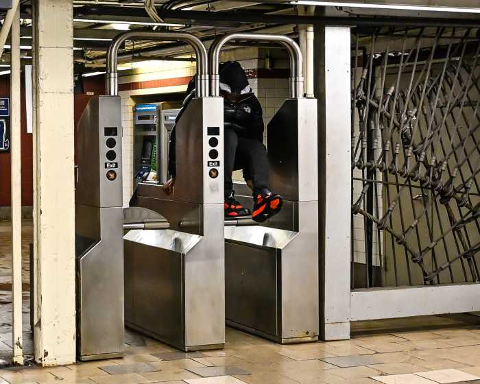 Fare evasion: MTA battling scourge of scofflaws boarding buses without paying their fair share 4 person evading a fare by jumping over a turnstile in an MTA subway station