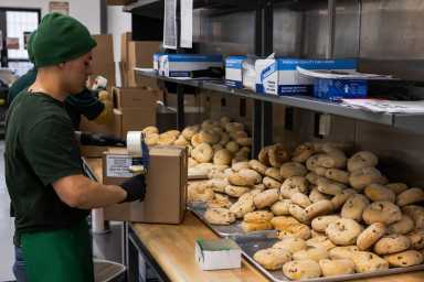 One with everything: Ess-a-Bagel’s new factory in Harlem helps keep business growing  26 an ess-a-bagel employee with lots of bagels