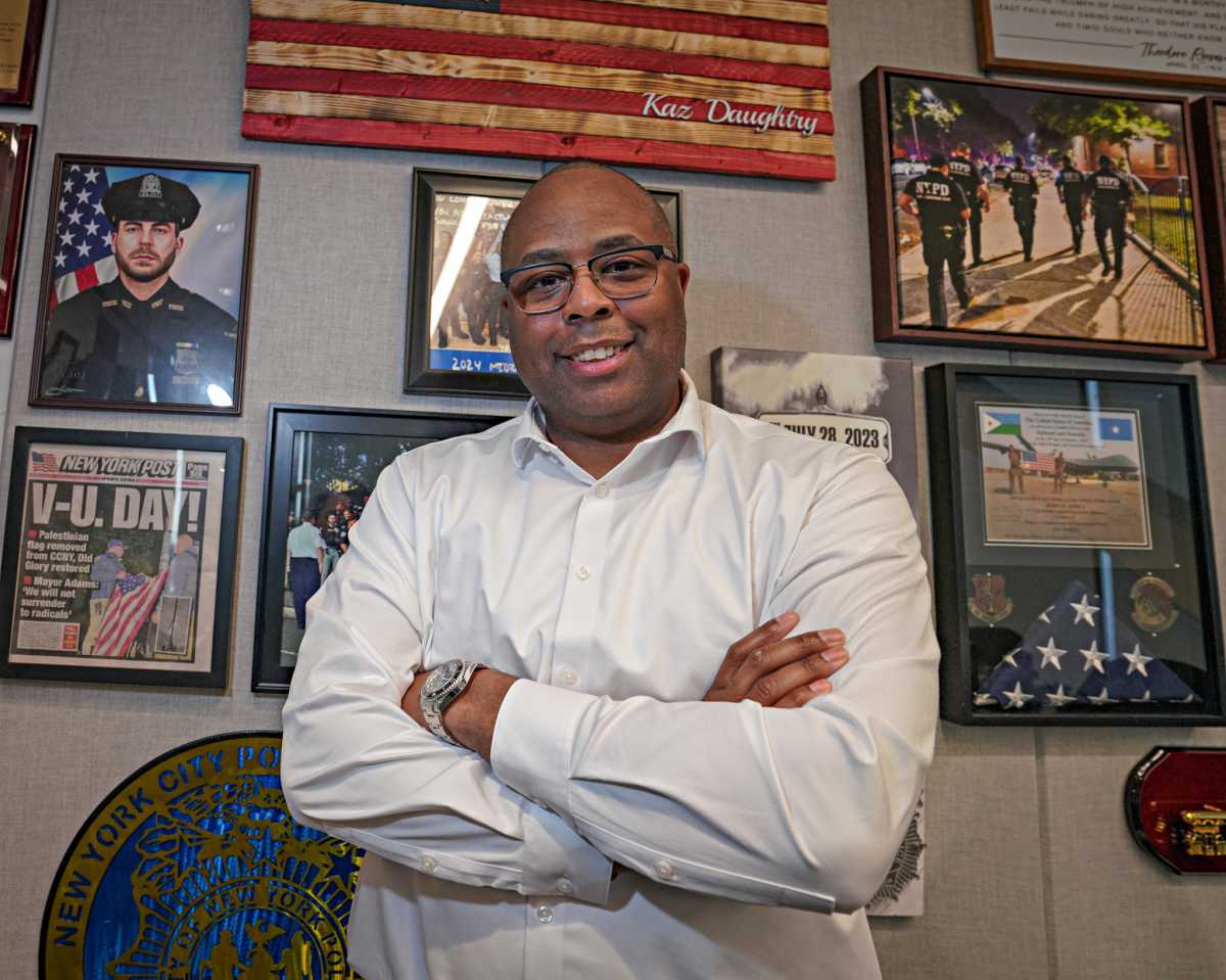 Kaz Daughtry standing with arms crossed