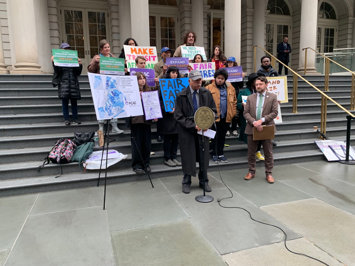 people on stairs outside, advocating for Fair Fares