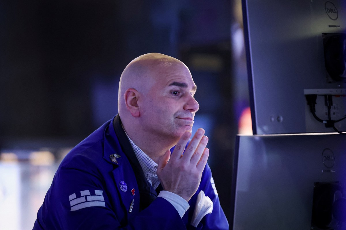 Trump's tariffs spark uncertainty, price fears among Manhattan businesses 2 Manhattan stock broker pensive during trading amid Trump tariffs