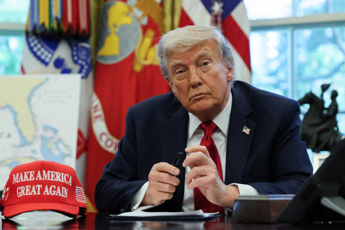 Trump tariffs: New York joins interstate lawsuit seeking to stop largest 'federal tax hike in history' 2 Trump at desk with MAGA hat