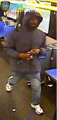 man wearing dark-colored clothing on MTA bus