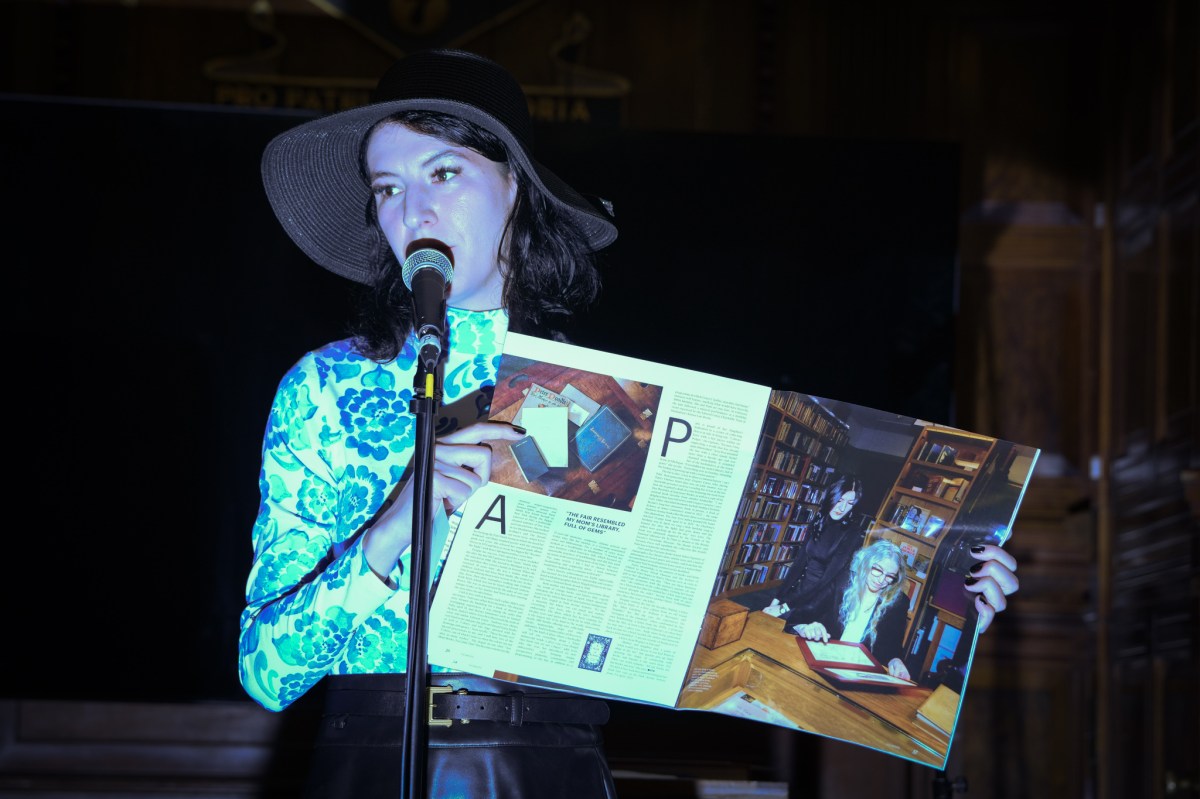 Musical icon Patti Smith and daughter Jesse Paris Smith make surprise performance at New York International Antiquarian Book Fair 2 Patti Smith's daughter Jesse Smith holding magazine at Antiquarian Book Fair