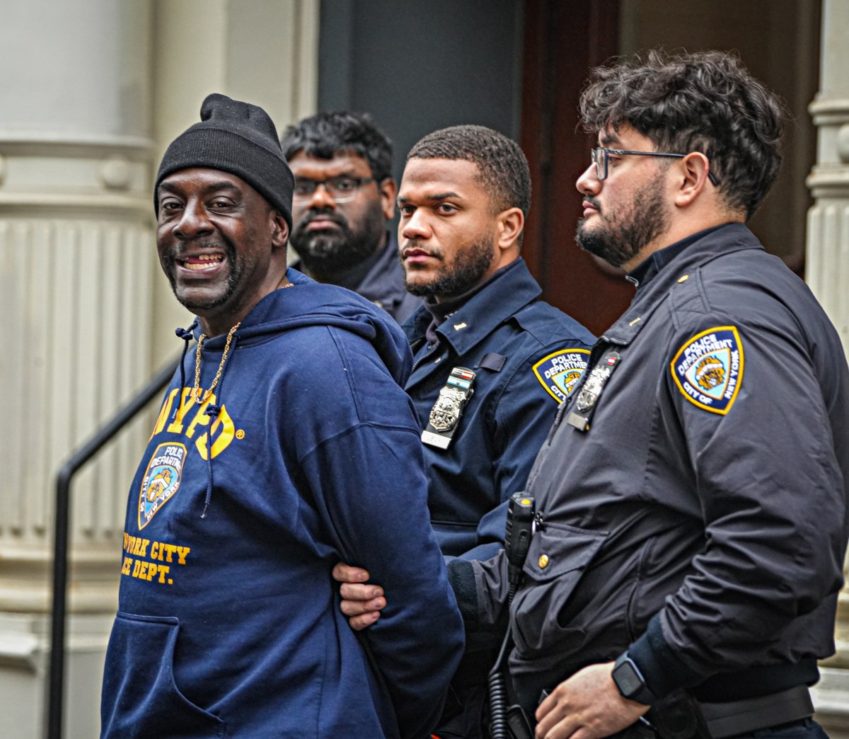 Suspect smiles after being arrested for SoHo stabbing