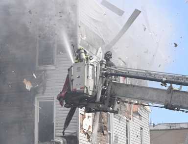 Firefighters battle fire at Queens building