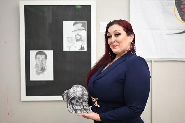 The art of confinement: Rikers Island detainees' work goes on display in Brooklyn 3 Manager of the Herbert Von King Cultural Arts Center Colleen Flood poses alongside the hat designed by her husband, which sparked the idea for Bed-Stuy exhibition