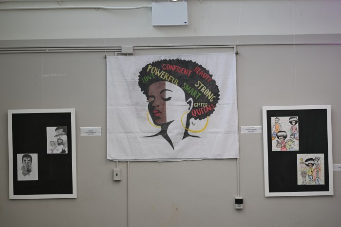 Some of the original artwork by Rikers Island detainees hanging in a Bed-Stuy, themed around the meaning of community.