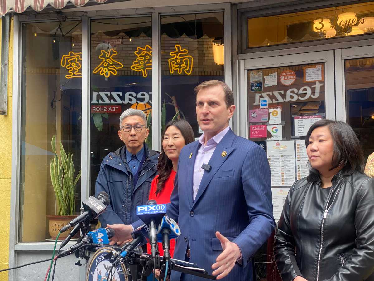 Rep. Dan Goldman speaking to reporters in Chinatown Monday Rep. Grace Meng, and Assembly Member Grace Lee