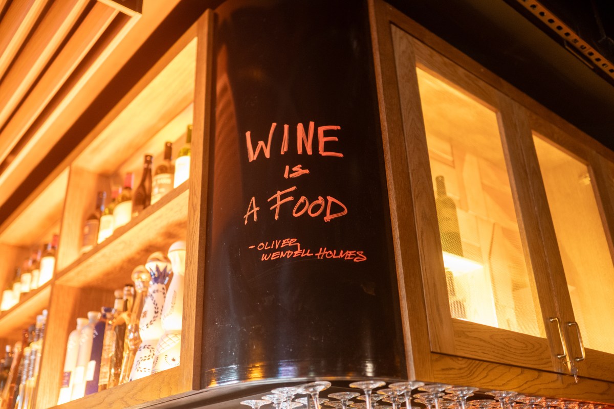 "Wine is aa food" written on the wall near the bar at Bar Mercer
