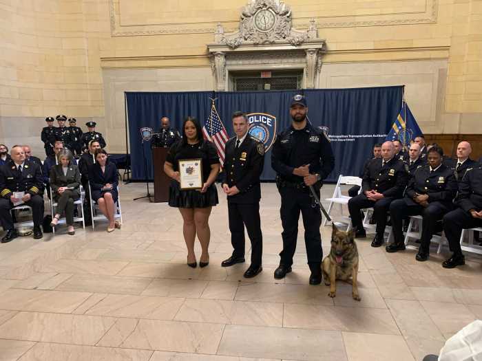 MTA police with a dog inside terminal