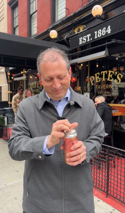 Outdoor dining in NYC could become year round under mayoral candidate Lander's plan 3 man with a drink outside a restaurant