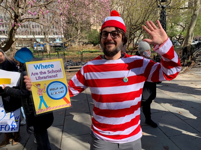 Reopen the books: Parents, teachers and students rally to restore NYC public school libraries 3 man dressed as Where's Waldo? advocating for public school libraries in NYC