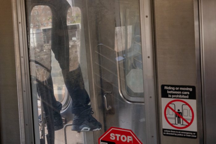 a person subway surfing in the daytime